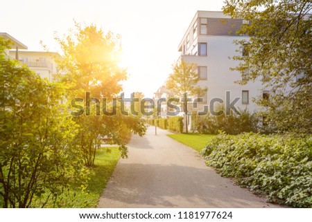 Modern residential buildings with new apartments in a green residential area Royalty-Free Stock Photo #1181977624