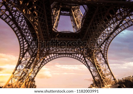 Eiffel tower from below, with epic colorful sky, great frame.  Romantic photo
