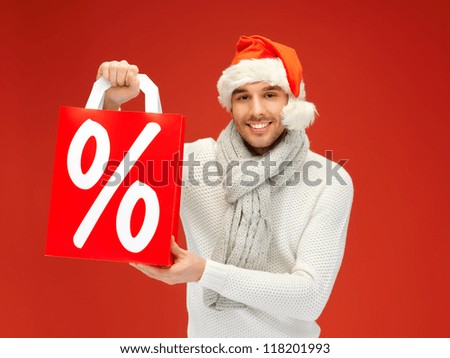 bright picture of handsome man in christmas hat .