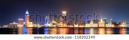 Shanghai historic architecture panorama at night lit by lights over Huangpu River