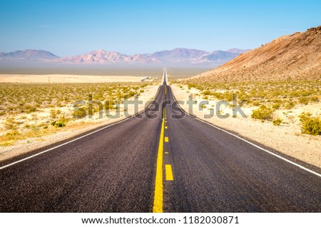 Never Ending Road to Death Valley National Park, California-USA Royalty-Free Stock Photo #1182030871