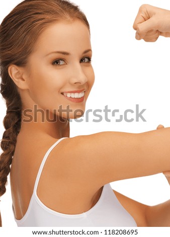 closeup picture of sporty woman flexing her biceps