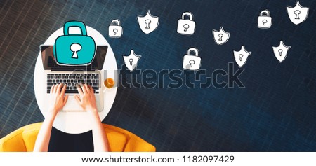Cyber Security with person using a laptop on a white table