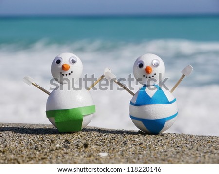 snowman beach vacation holidays from cold winter