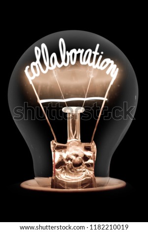 Photo of light bulb with shining fiber in a shape of COLLABORATION concept word isolated on black background