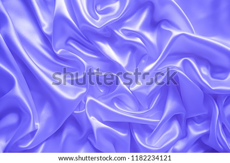 Smooth elegant wavy light sky blue satin silk luxury cloth fabric texture, abstract background design.