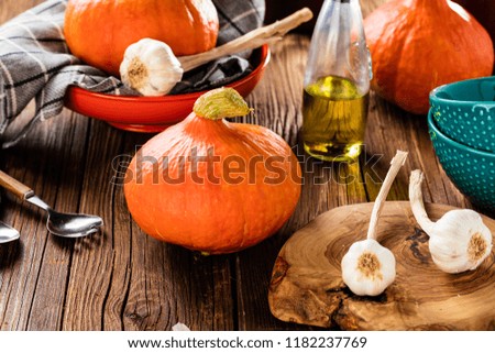 Ripe pumpkin, sliced pumpkin, pumpkin on the old board background 