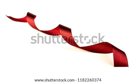 Red fabric ribbon isolated on white background.