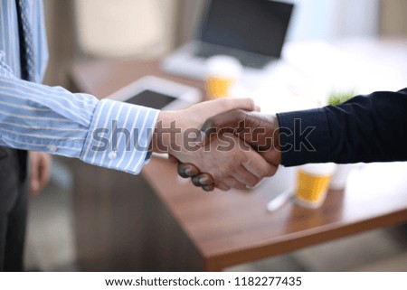 Business partnership handshake concept.Photo two coworkers handshaking process.Successful deal after great meeting.
