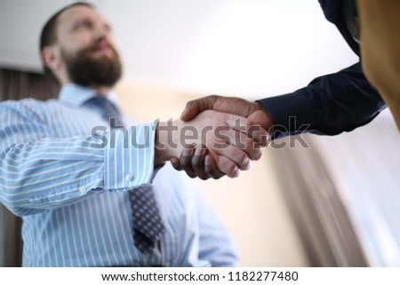 Business partnership handshake concept.Photo two coworkers handshaking process.Successful deal after great meeting.
