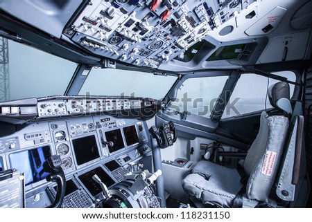 Boeing interior, cockpit view inside the airliner Royalty-Free Stock Photo #118231150