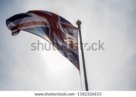 British union jack flag waggling in the wind with sky
