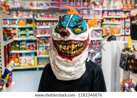 A boy with ADHD, Autism, Aspergers Syndrome wearing a very scary halloween costume mask ready for trick or treat night