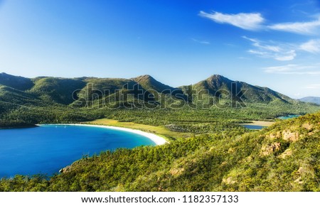 Wineglass Bay on the Freycinet Peninsula in North East Tasmania on a clear sunny day. Royalty-Free Stock Photo #1182357133
