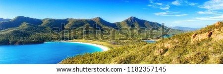 Wineglass Bay on the Freycinet Peninsula in North East Tasmania on a clear sunny day. Royalty-Free Stock Photo #1182357145