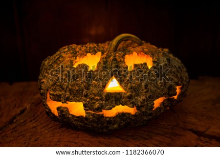 Halloween pumpkin on old wooden table