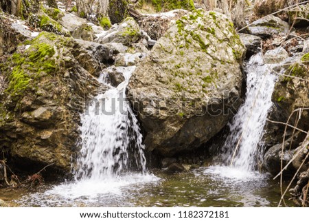 Autumn waterfall with rocks and leaves in Troodos mountains in Cyprus
