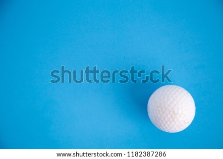 golf ball on blue color background