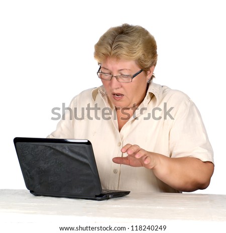 stock photo woman is working on laptop. elderly woman scared the results of use laptop.
