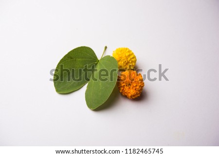Indian Festival Greeting Card - Happy Dussehra, showing golden leaf and flowers on moody background. .
 Royalty-Free Stock Photo #1182465745