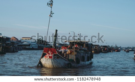 Tourists and people buy and sell on boat, ship in Cai Rang floating market at Mekong River. Royalty free stock image of the floating market or river market in Vietnam