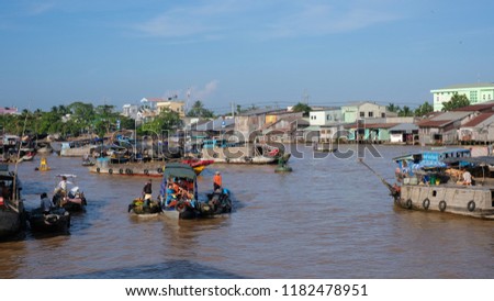Tourists and people buy and sell on boat, ship in Cai Rang floating market at Mekong River. Royalty free stock image of the floating market or river market in Vietnam