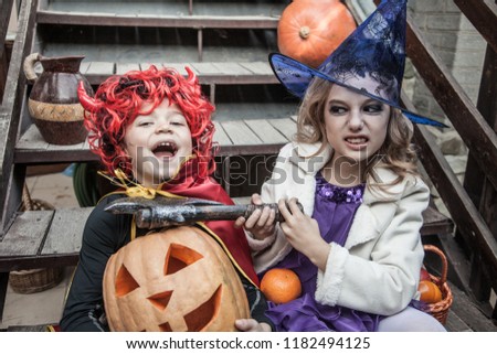 kids in halloween costumes playing outdoor