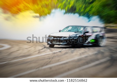 Fast speed car driver drifting drag racing car burns rubber