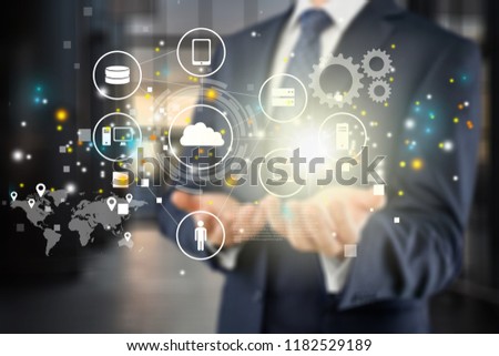 Businessman and analytics symbols on blurred background