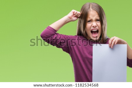 Young beautiful girl holding blank sheet paper over isolated background annoyed and frustrated shouting with anger, crazy and yelling with raised hand, anger concept