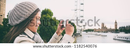London europe travel woman taking pictures with phone panorama banner. Tourist holding smartphone camera taking photos at Big Ben, Westminster Bridge, London, England