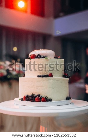 Wedding or birthday cake with berries. Sweet pie on banquet in restaurant.	