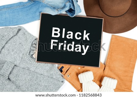 Black Friday promotion banner concept. Autumn clothing essentials for fashion boutique look book showcase. Casual set of matching garment items. Background, close up, top view, flat lay.