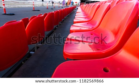 Empty plastic red seats 