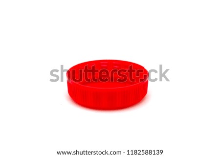 Red lid from bottle on white isolated background