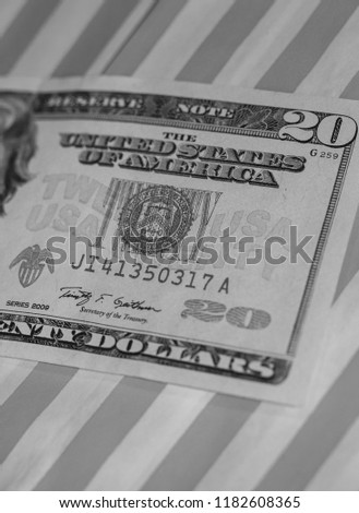 A Twenty Dollar Bill on Red & White Striped background (B&W Green Filtered)