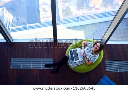 young beautiful girl working with modern computers in a modern environment