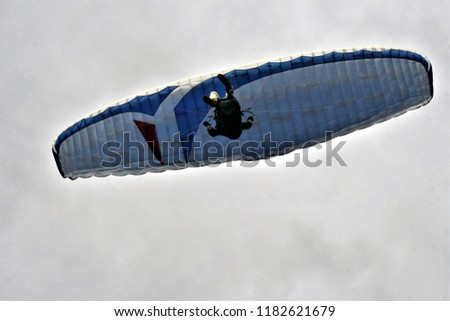 Sportsmen practicing paragliding on the beach of Los Cristianos, Tenerife,