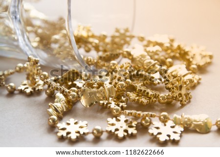 Christmas ornaments, gold snowflakes with sunlight and shiny 
