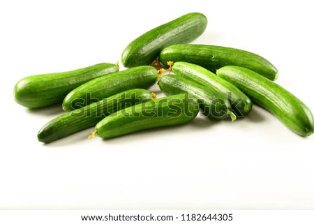 Organic fresh green cucumbers on white background,