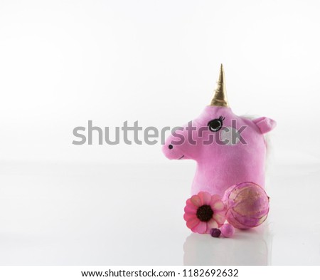 CUTE UNICORN HEAD WITH FLOWERS ON WHITE BACKGROUND