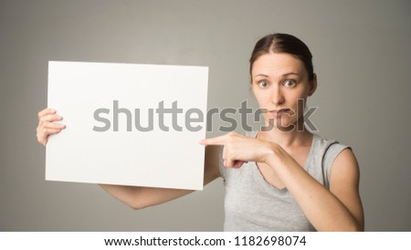 Girl holding white blank sign