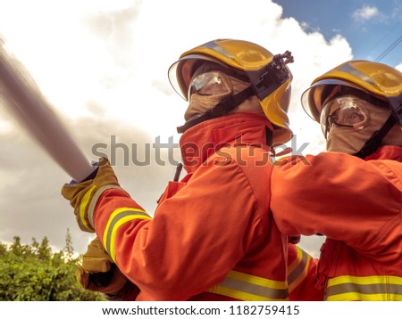 Firefighters working as a team in emergency situations.