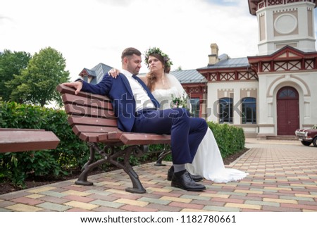 Bride and husband wedding happy together sitting near the railway station copy space banner 