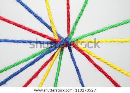 Colorful ribbons create many links and cross each other.