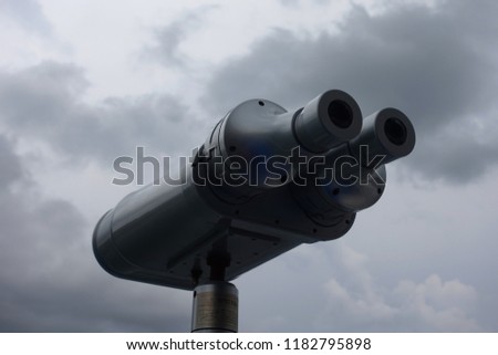 Telescopic binoculars as seen in ship traveling over mediterranean sea on a cloudy morning