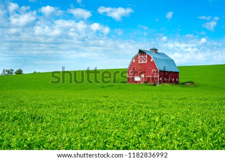 Red Barn in Palouse Rolling hills, Washington-USA  Royalty-Free Stock Photo #1182836992