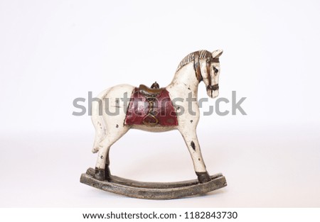 Old toy rocking horse isolated on white background. Copy space.