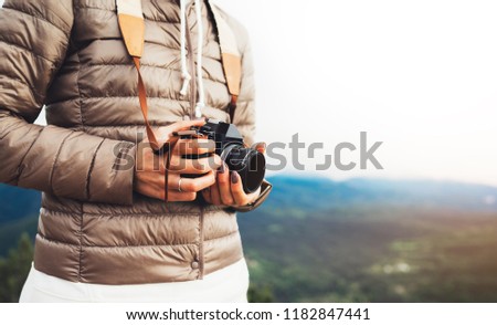 photographer traveler on mountain, tourist holding in hands digital photo camera closeup, hiker taking click photography, girl enjoy nature panoramic landscape in trip, relax holiday hobby concept