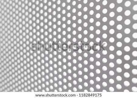 Background of a metal perforated gray grille